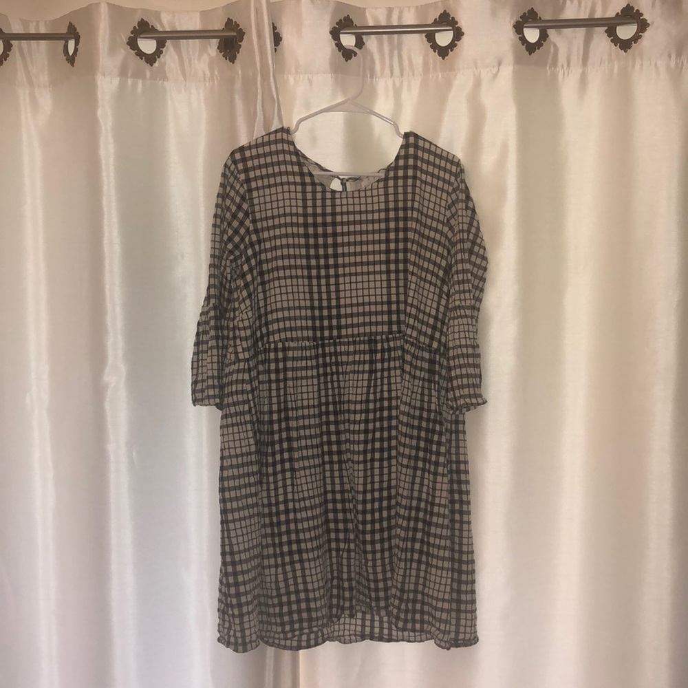 CHECKERED DRESS WITH RED TASSEL IN THE BACK!